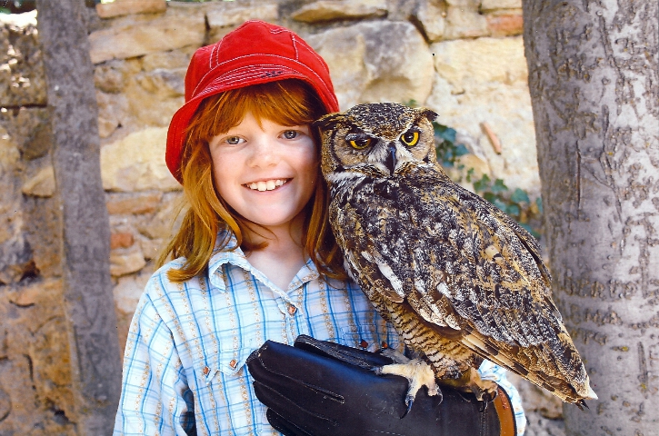 Cielo holding an owl on her arm