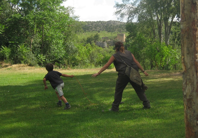boy running from raptor