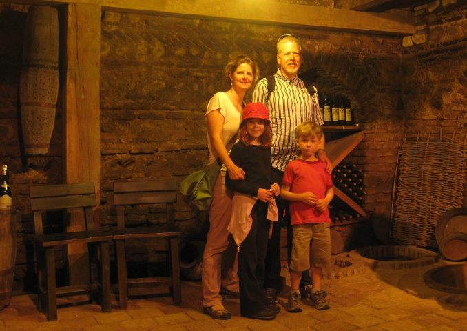 family in a wine cellar