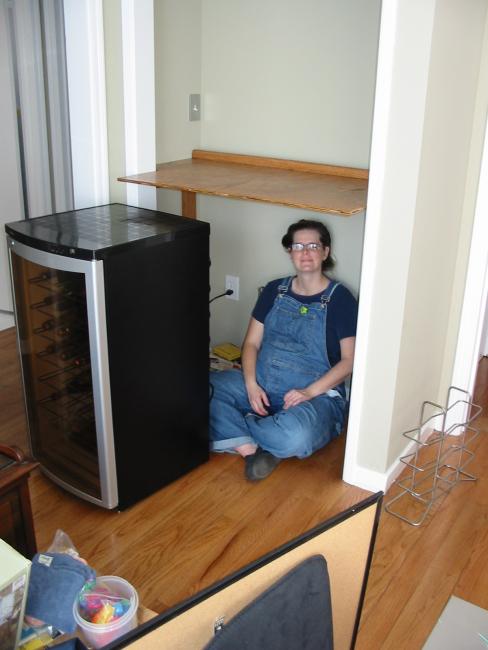 Alison sittng under the top